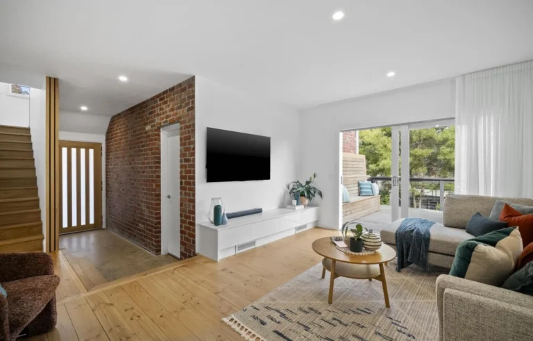 Modern living room with natural light and patio view.