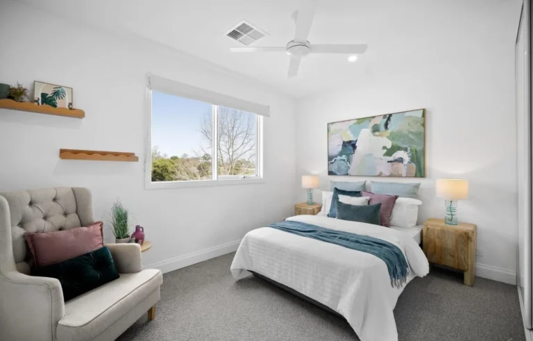 Modern bedroom with abstract art and natural lighting