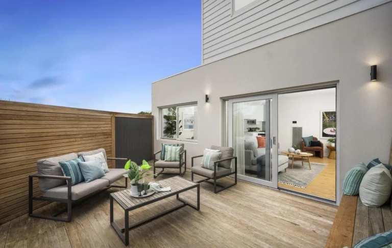 Modern patio with outdoor seating and plants.